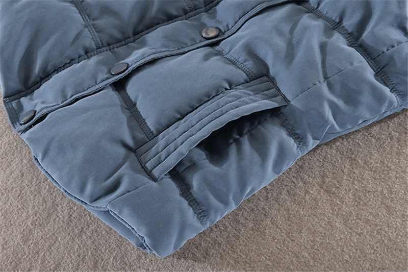 Close-up of women's sleeveless cotton jacket with buttons and pocket detail, elegant casual hooded vest in blue. Product code: SF0023.